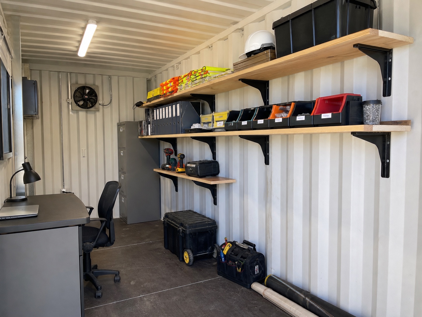 Shelf brackets and office storage inside a shipping container