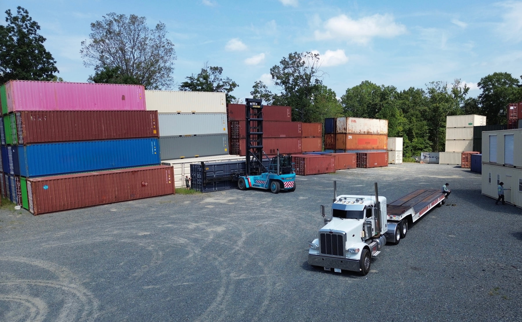 Delivery truck positioned in the PVG container yard for coordinated transport.